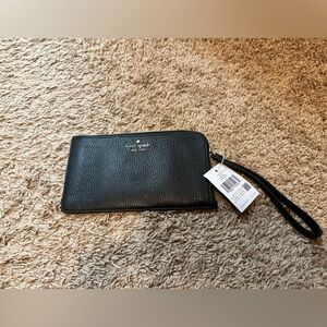 Kate Spade wristlet with tags. Brand new